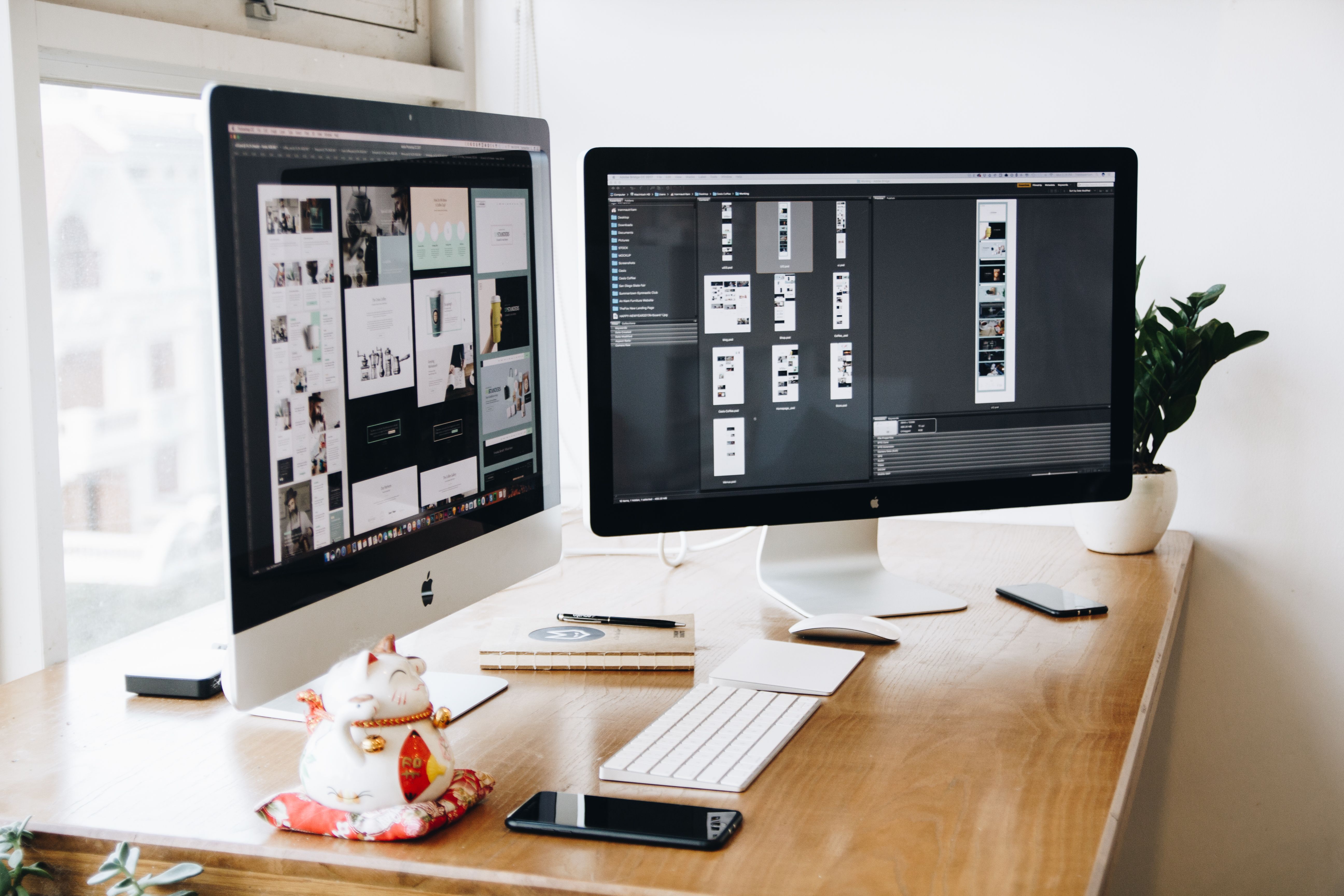 Web design workspace with website layouts and interface planning materials
